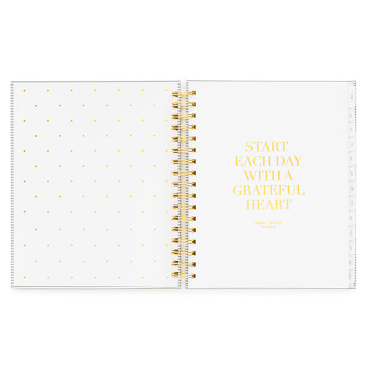 Open front cover page of the academic planner 'start each day with a grateful heart' quote in gold foil