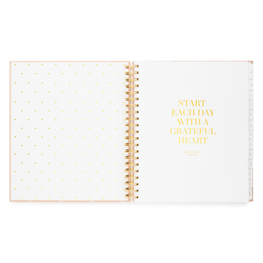 Open spiral planner with 'start each day with a grateful heart' with cover page in gold foil