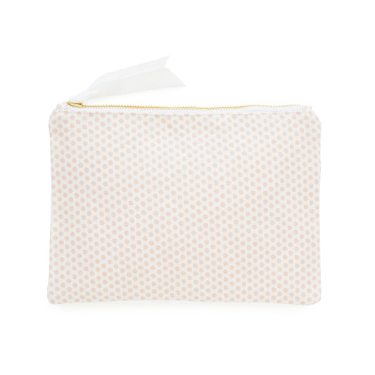 White and pink dot pouch with gold zipper and white ribbon pull