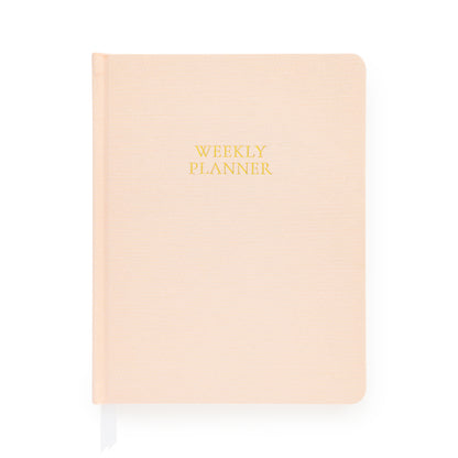 Pink planner with gold foil 'weekly planner' on cover