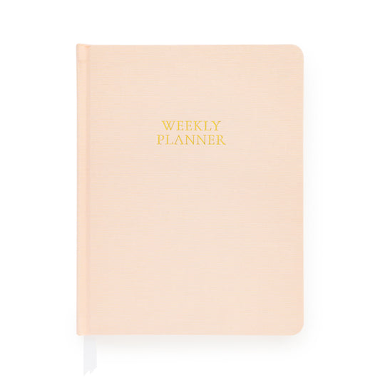 Pink planner with gold foil 'weekly planner' on cover