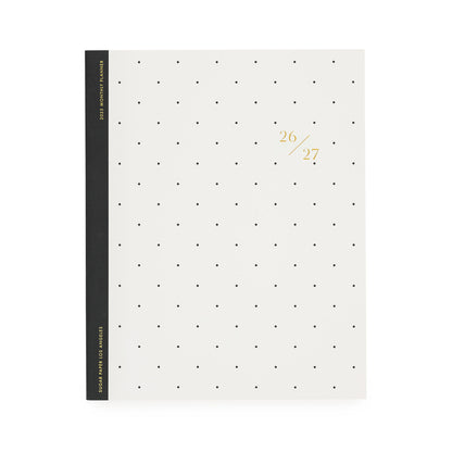 White planner with black dot pattern, black tape binding, and gold foil 26/27