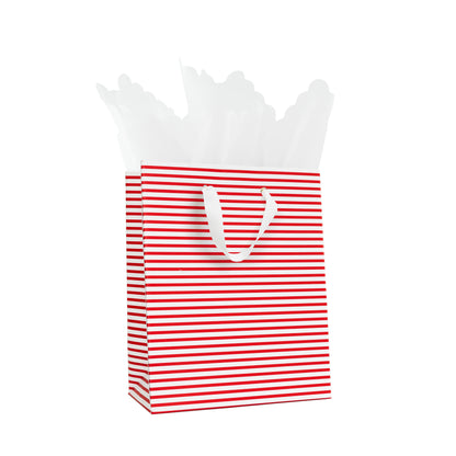 Red and white stripe gift bag with white grosgrain ribbon handles with white scallop tissue paper