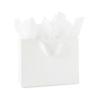 large white gift bag with white ribbon handles with gold foil dot pattern with white scallop tissue paper