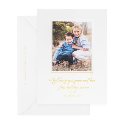 white custom holiday card with gold foil details and photo