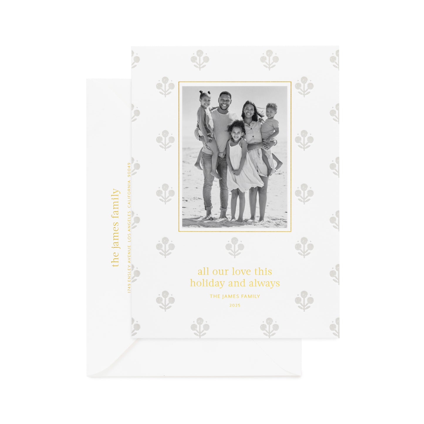 Grey floral pattern on white paper custom holiday card with a family photo in black and white printed in gold foil 'all our love this holiday and always' paired with a white envelope