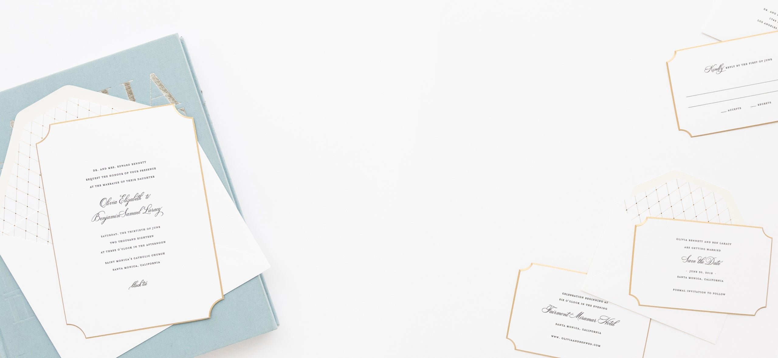 wedding invitation suite with black letterpress on white extra thick paper with gold beveled die cut edges