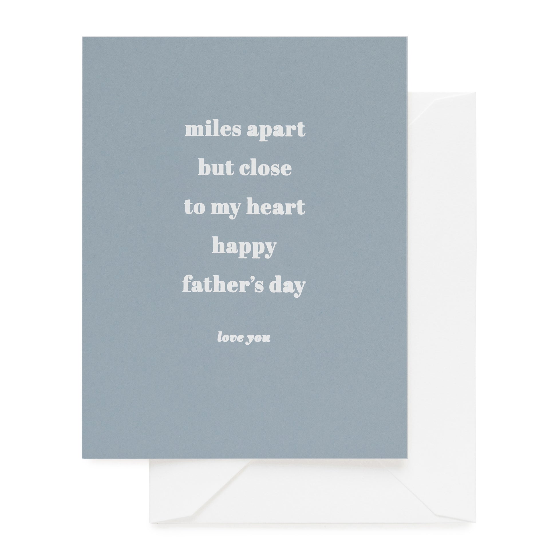 slate blue card with white ink printed with miles apart but close to my heart happy father's day love you