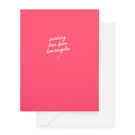 Hot pink card foil printed with sending love from los angeles and a gold heart