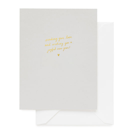 Grey greeting card foil printed in gold foil 'sending you love and wishing you a joyful new year' paired with a white envelope