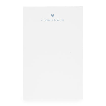 White notepad with heart and "elizabeth bennett" in blue