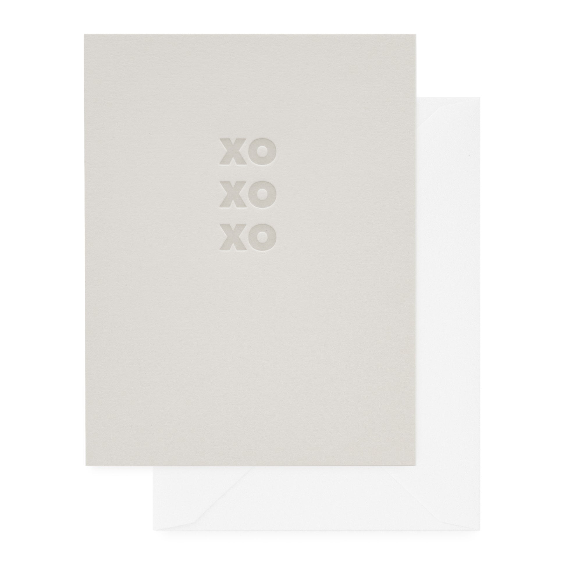 Pale grey card with 'xoxoxo' printed in grey ink paired with a white envelope