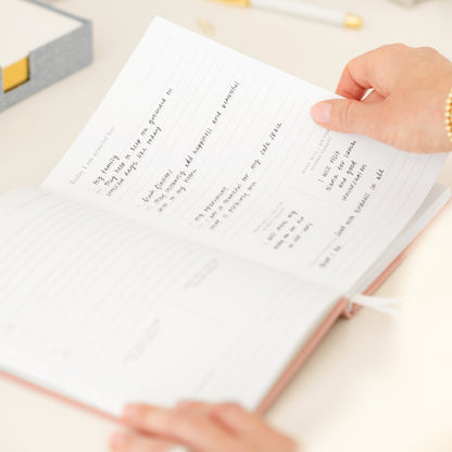 Interior of gratitude journal with writing