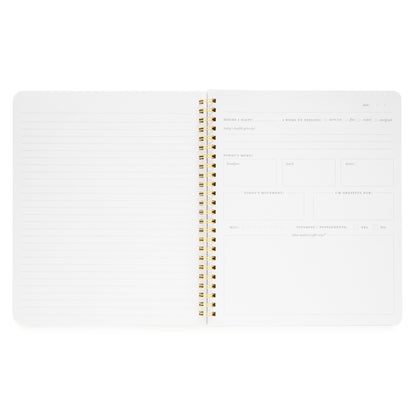 Interior of wellness notebook with daily prompts, menu, water tracker, supplements, today's movement, and grateful for