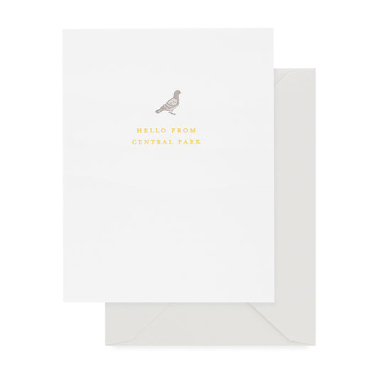 White greeting card with grey bird and printed with 'hello from central park' in gold foil paired with a gray envelope