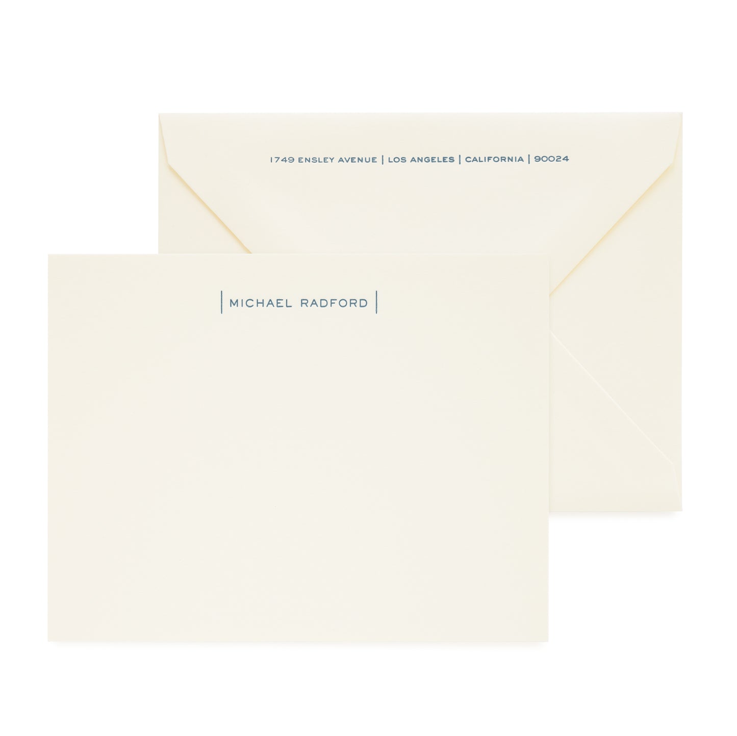 cream custom stationery card with navy letterpress ink and matching envelope