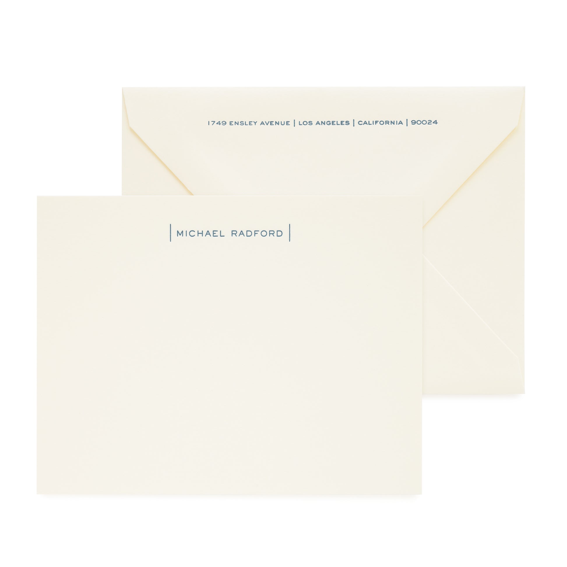 cream custom stationery card with navy letterpress ink and matching envelope