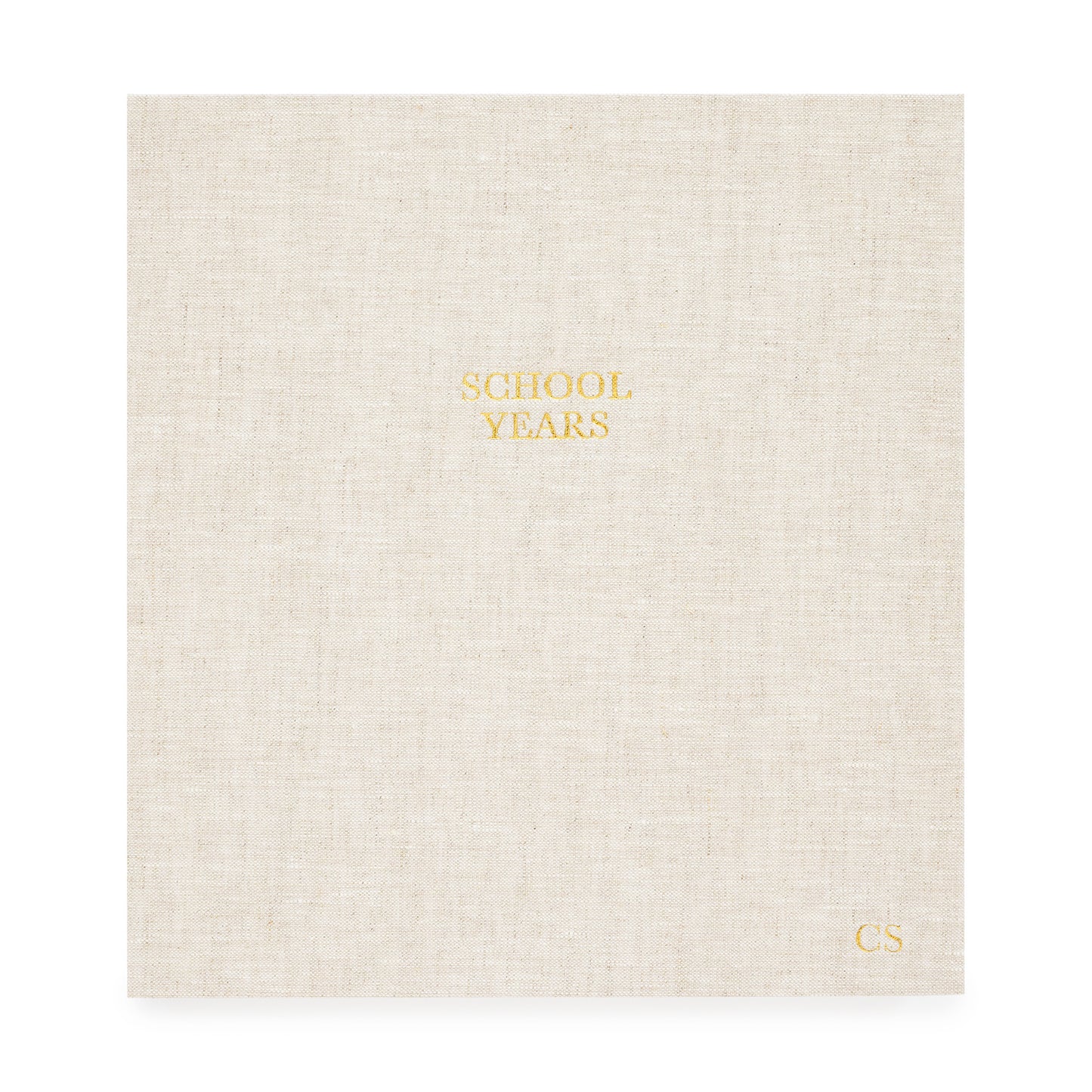 oversized school years book in a flax linen cover foil stamped with school years and kid's initials in gold foil