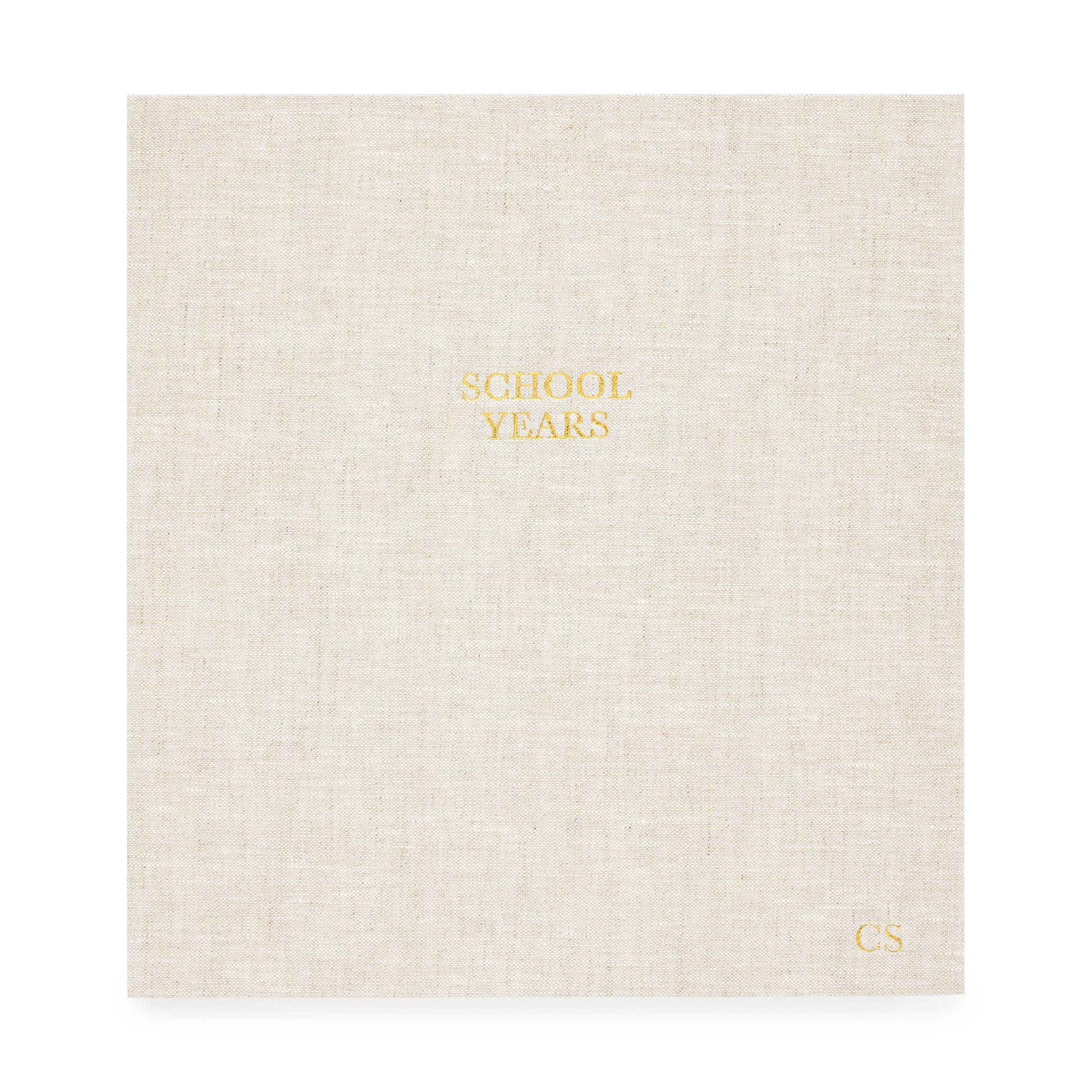 oversized school years book in a flax linen cover foil stamped with school years and kid's initials in gold foil