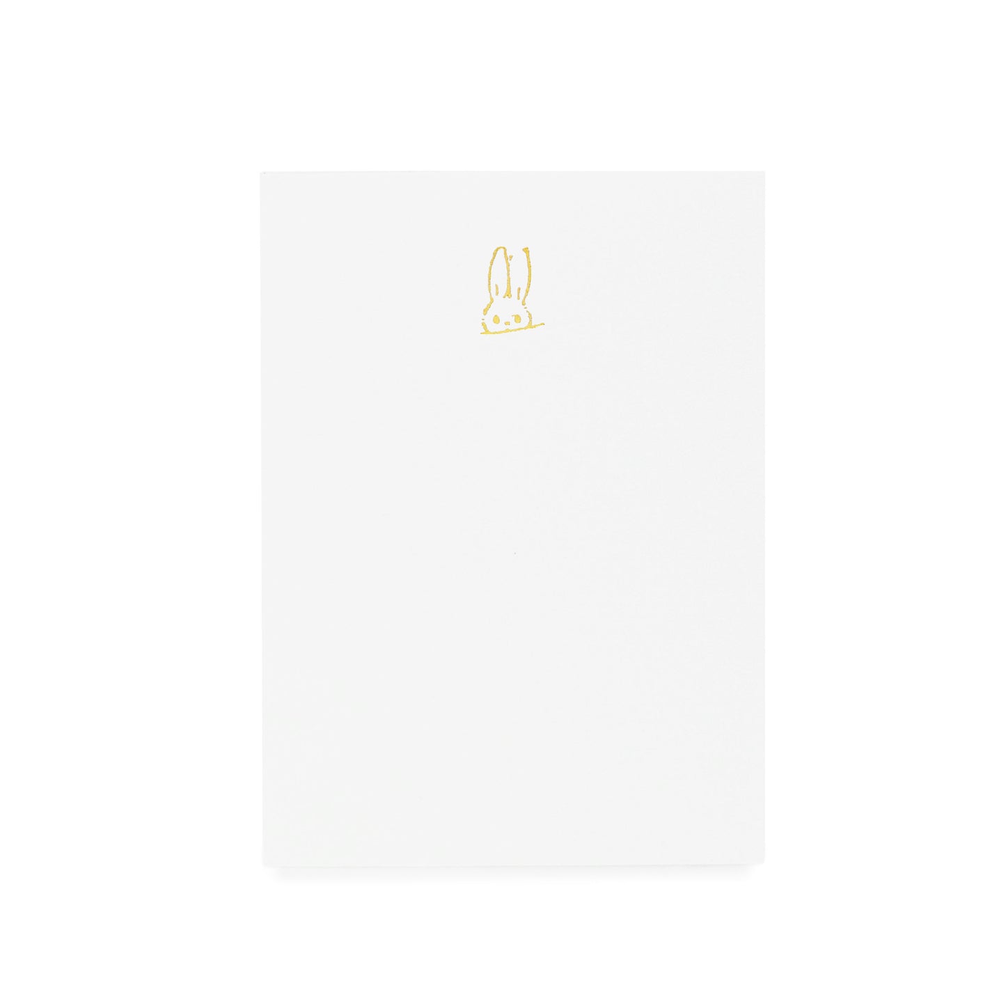 White notepad with gold hand sketched bunny foil printed on it