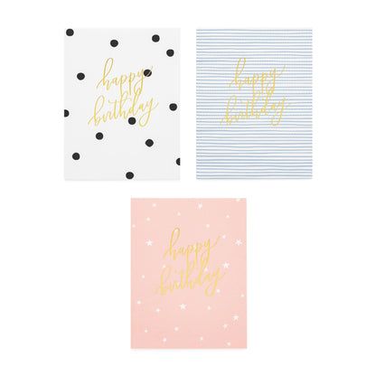 assorted happy birthday cards in black and white dot, blue and white stripe and pink with white stars all foil printed with happy birthday in gold script
