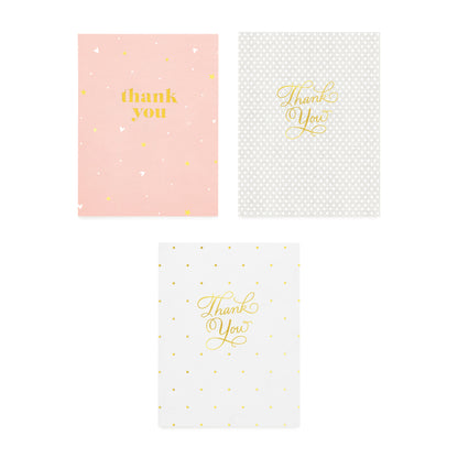 assorted thank you cards in pink with white and gold stars, grey and white dot, and white and gold dot all foil printed with thank you in gold