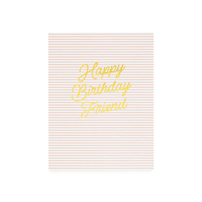 Card with 'Happy Birthday Friend' printed in gold foil on a pink striped background