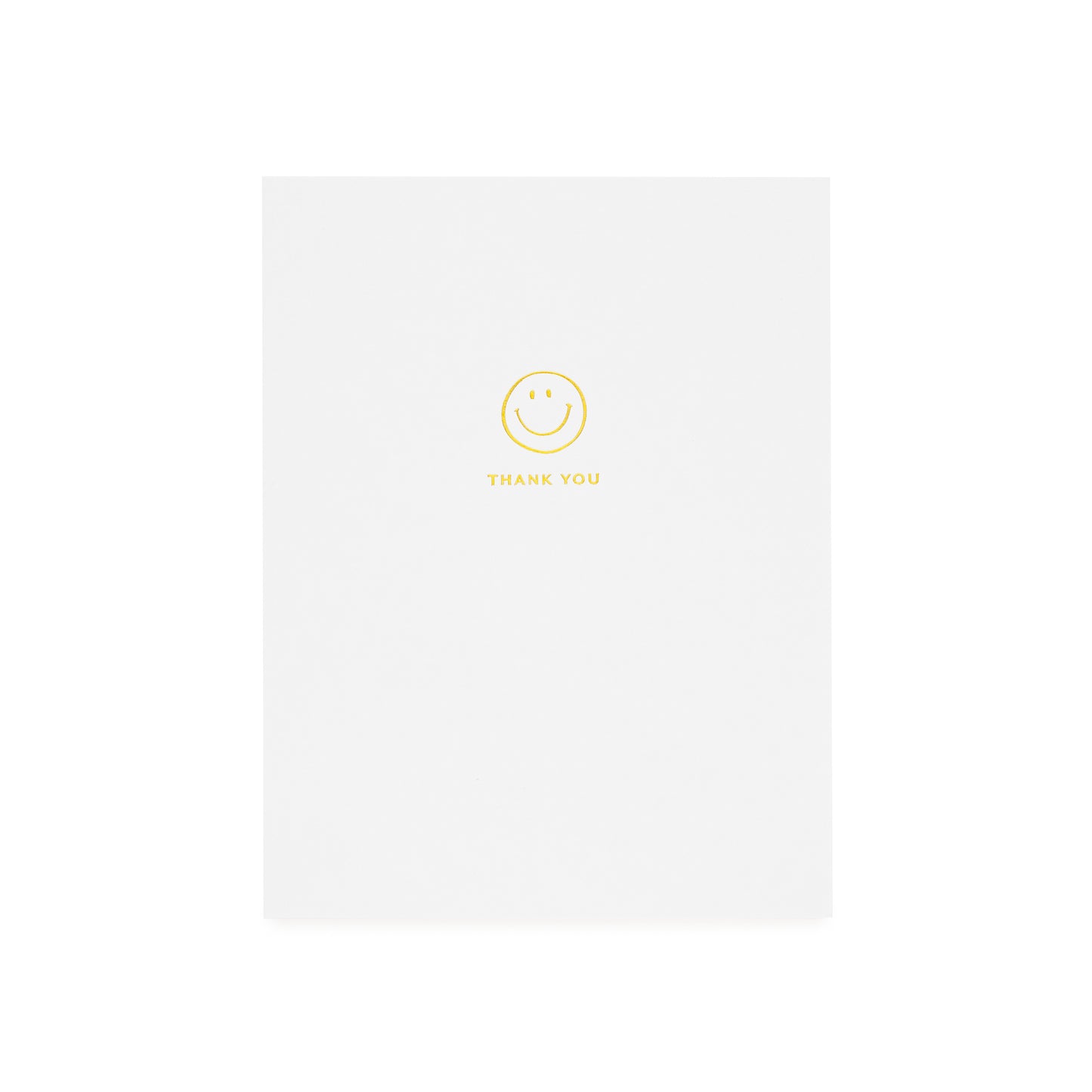 White greeting card printed with gold foil smiley icon and 'thank you'