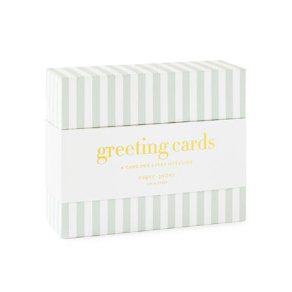 Box of greeting cards with green and white striped pattern and a white band printed with 'greeting cards a card for every occasion.'