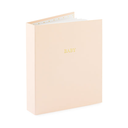 pink fabric baby book book open standing up foil stamped with baby in gold on the cover