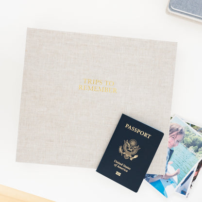 flax trips to remember book with passport on desk