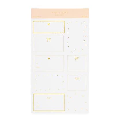 white and gold gift stickers with hearts, dots and bows and prompts for to and from