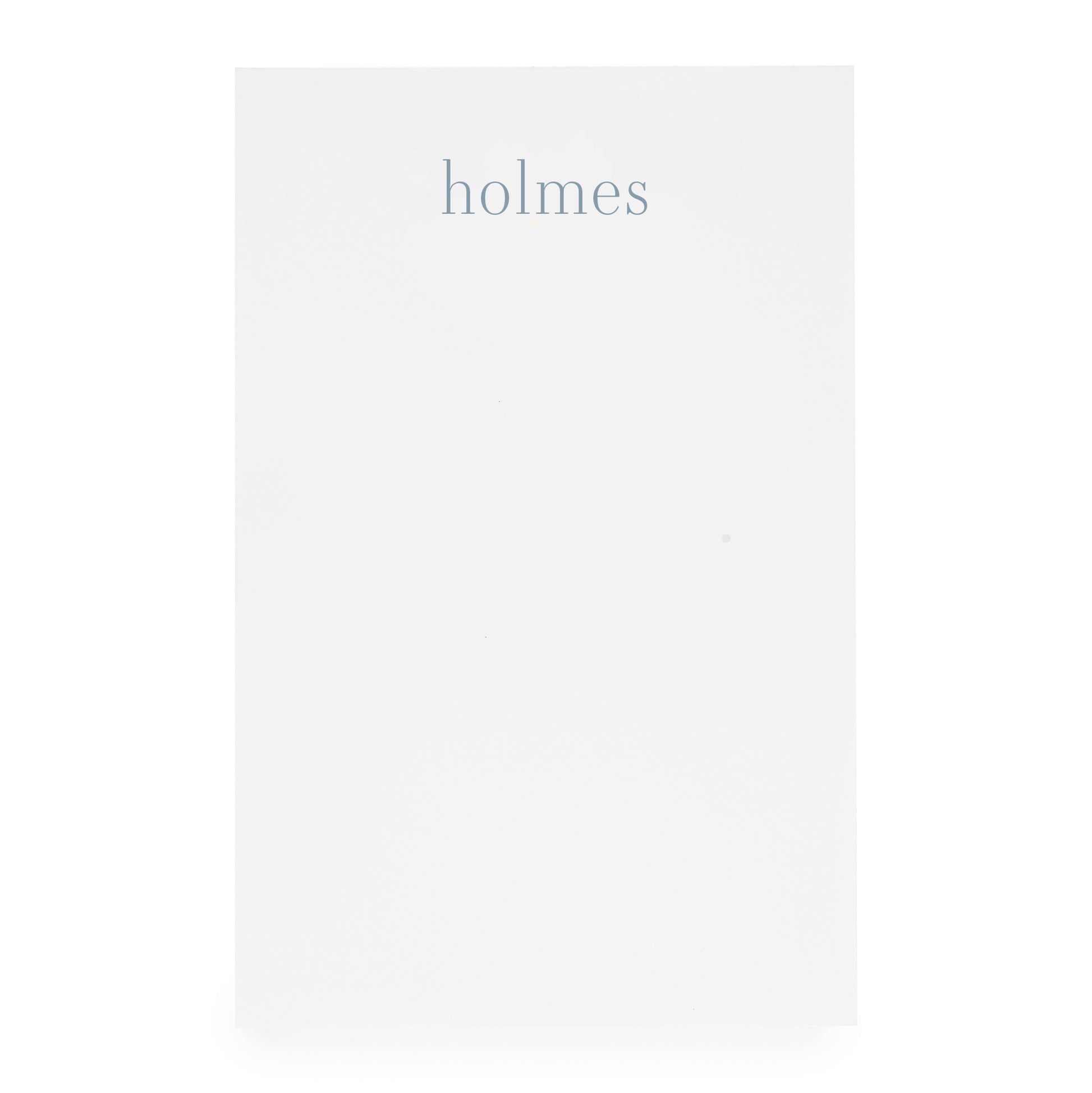 white notepad with blue 'holmes'