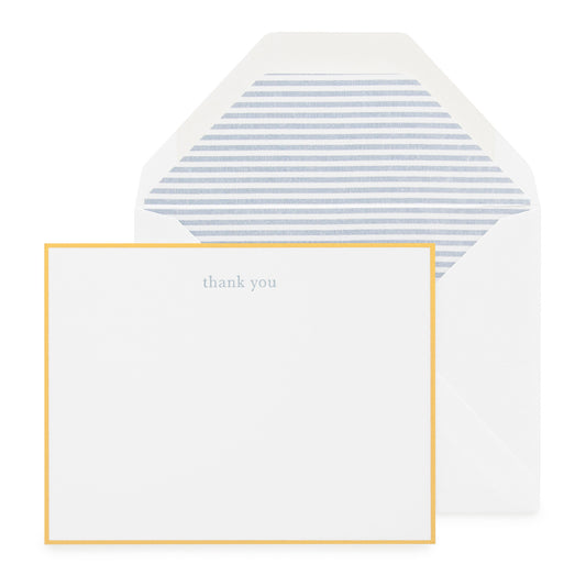 white card with blue thank you text and gold border, white envelope with blue ticking stripe liner