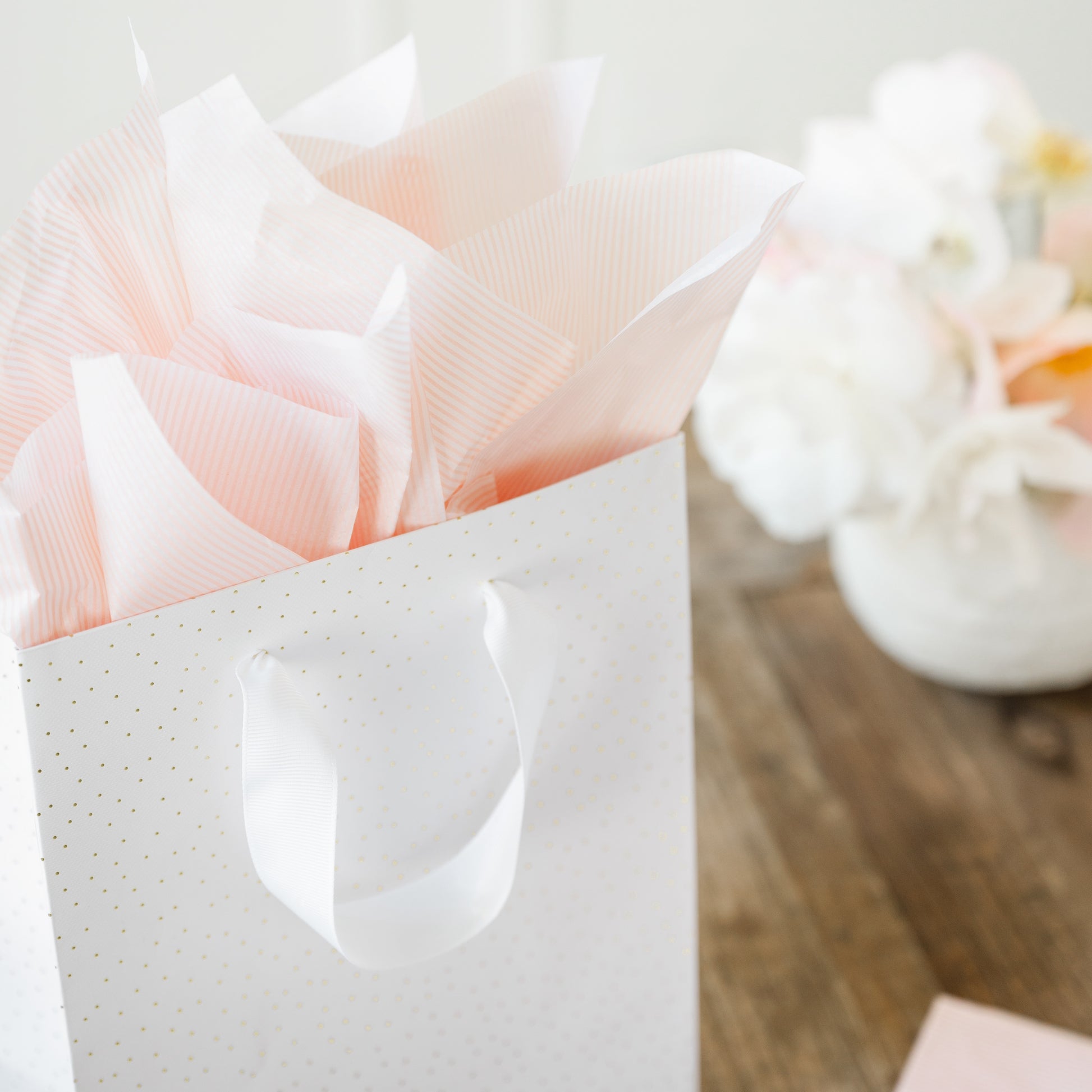 gold dot bag with rose stripe tissue paper