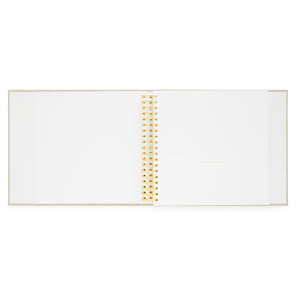 interior of trips to remember book with blank page for photos and a pocket for keepsakes from travels