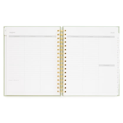 Open spiral bound planner with weekly layout and space for today's priority in the bottom of each day of the week