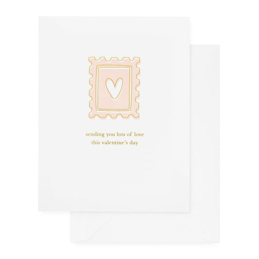 white card with pink and gold stamp and text, white envelope