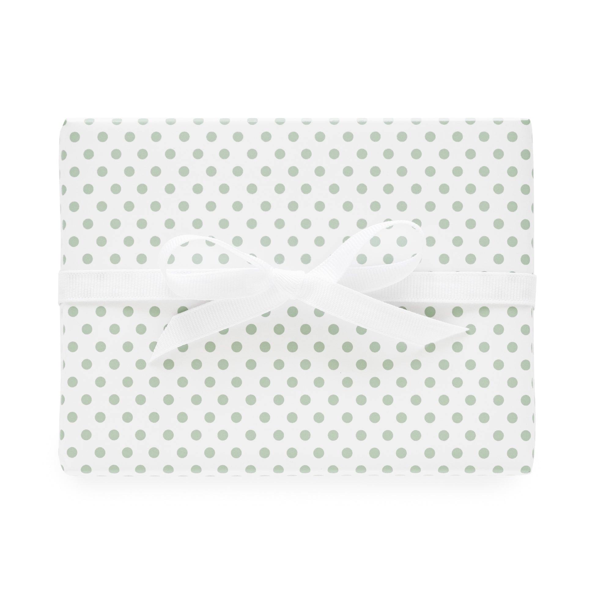 White and green dot wrapping paper wrapped package with white bow