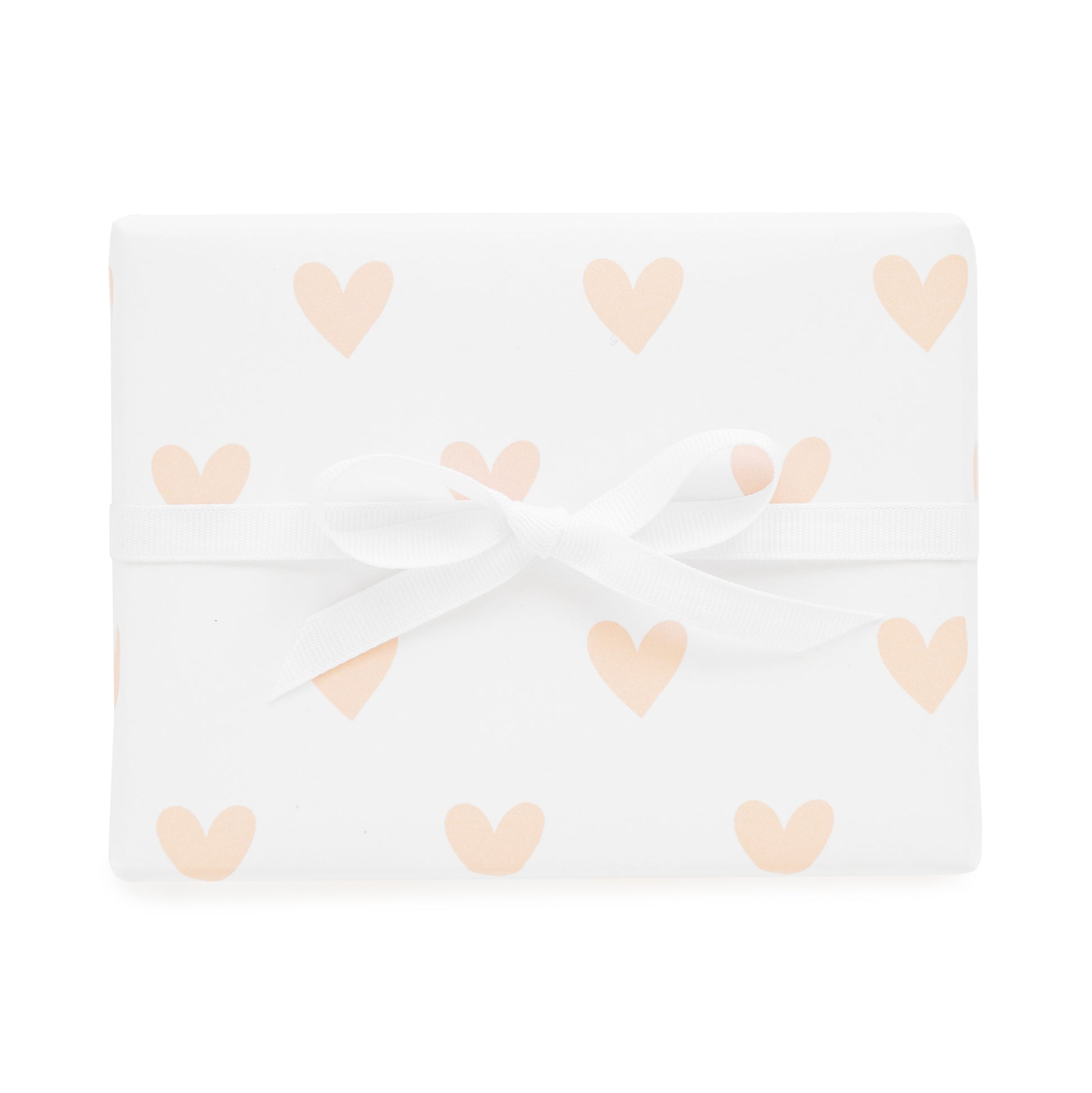 pink heart gift wrap shown tied with a white ribbon