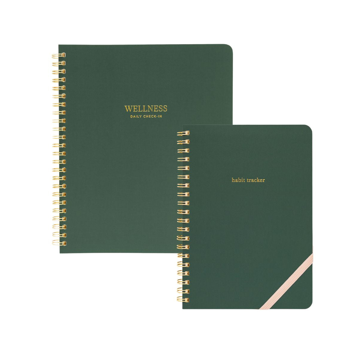 Two green spiral-bound notebooks labeled 'Wellness' and 'habit tracker'