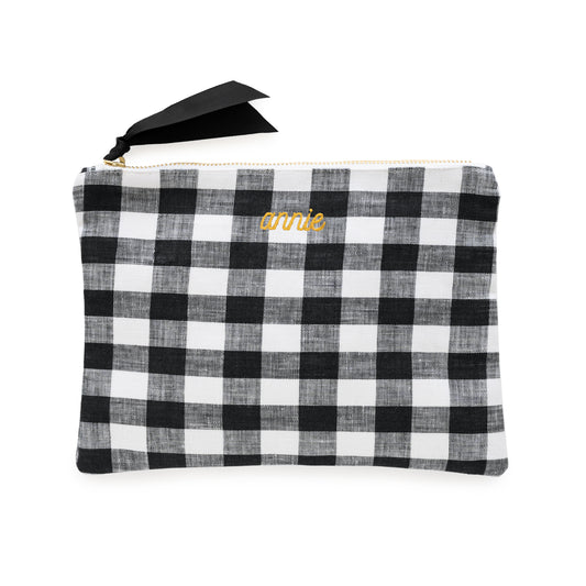 Black and white checkered pouch with 'annie' in mustard