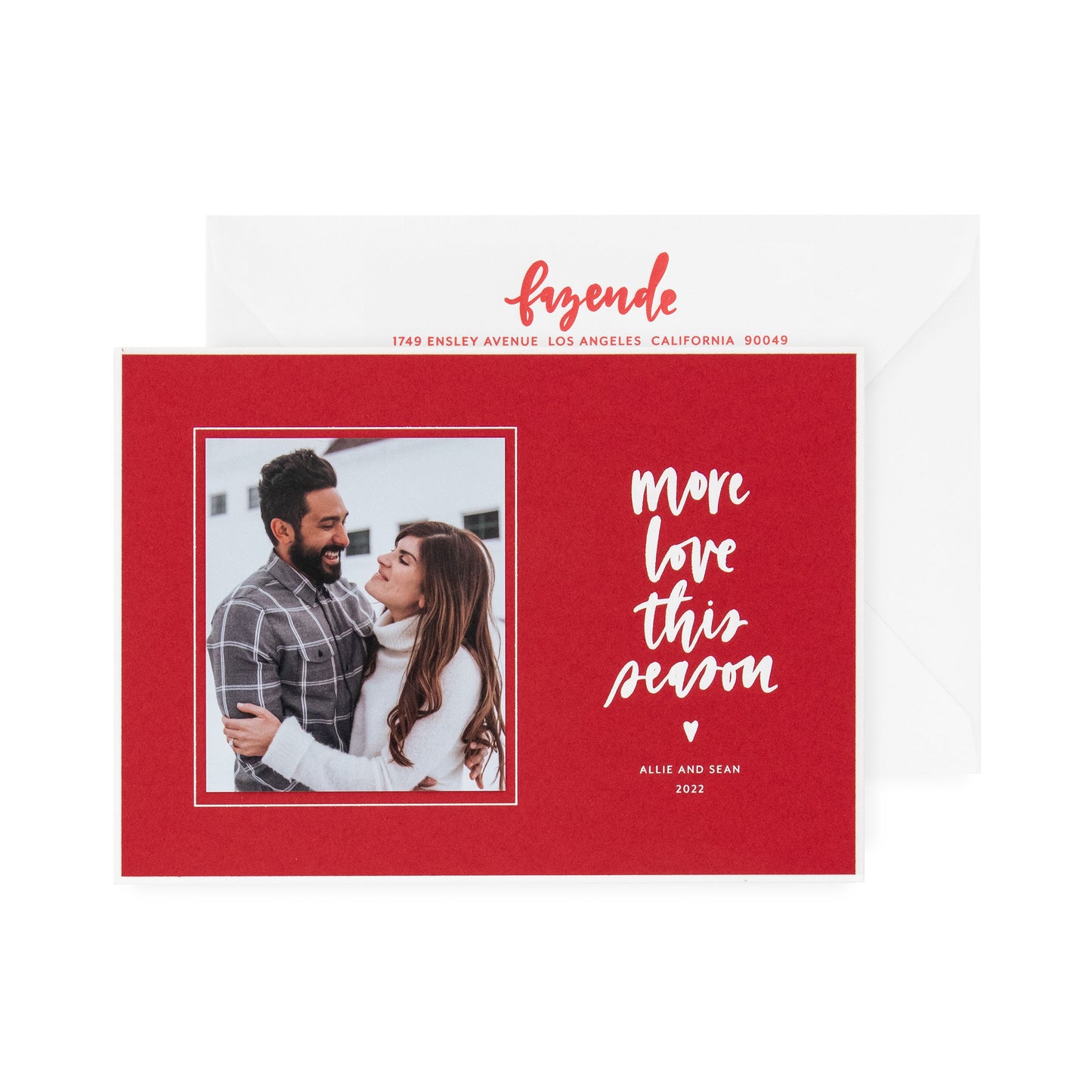 red card with photo and white text, white envelope with red text