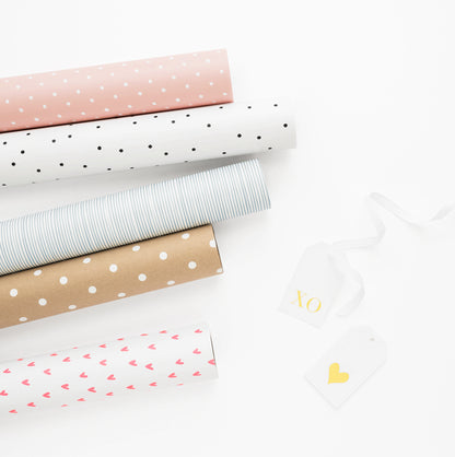 Stacked gift wrap rolls in all colors
