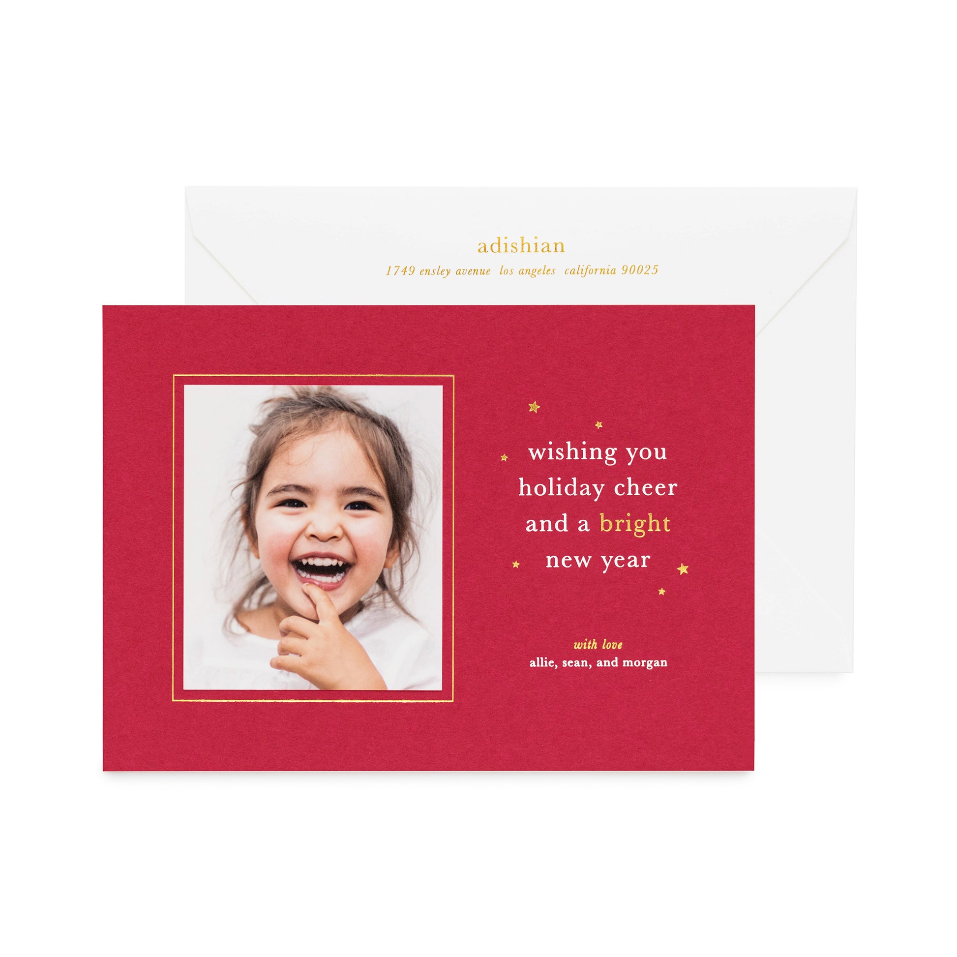 Red holiday photo card with white and gold foil printed "wishing you holiday cheer and a bright new year" and gold foil address on the envelope