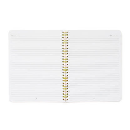 open spiral notebook showing lined pages