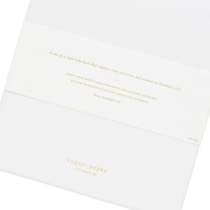 This is the back of the baby book box binding - it says "A one of a kind baby book that captures every milestone and moment in beautiful style."