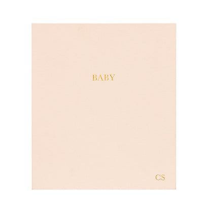 This is the cover of our baby book in a pale pink color for a baby girl. #color_pale-pink